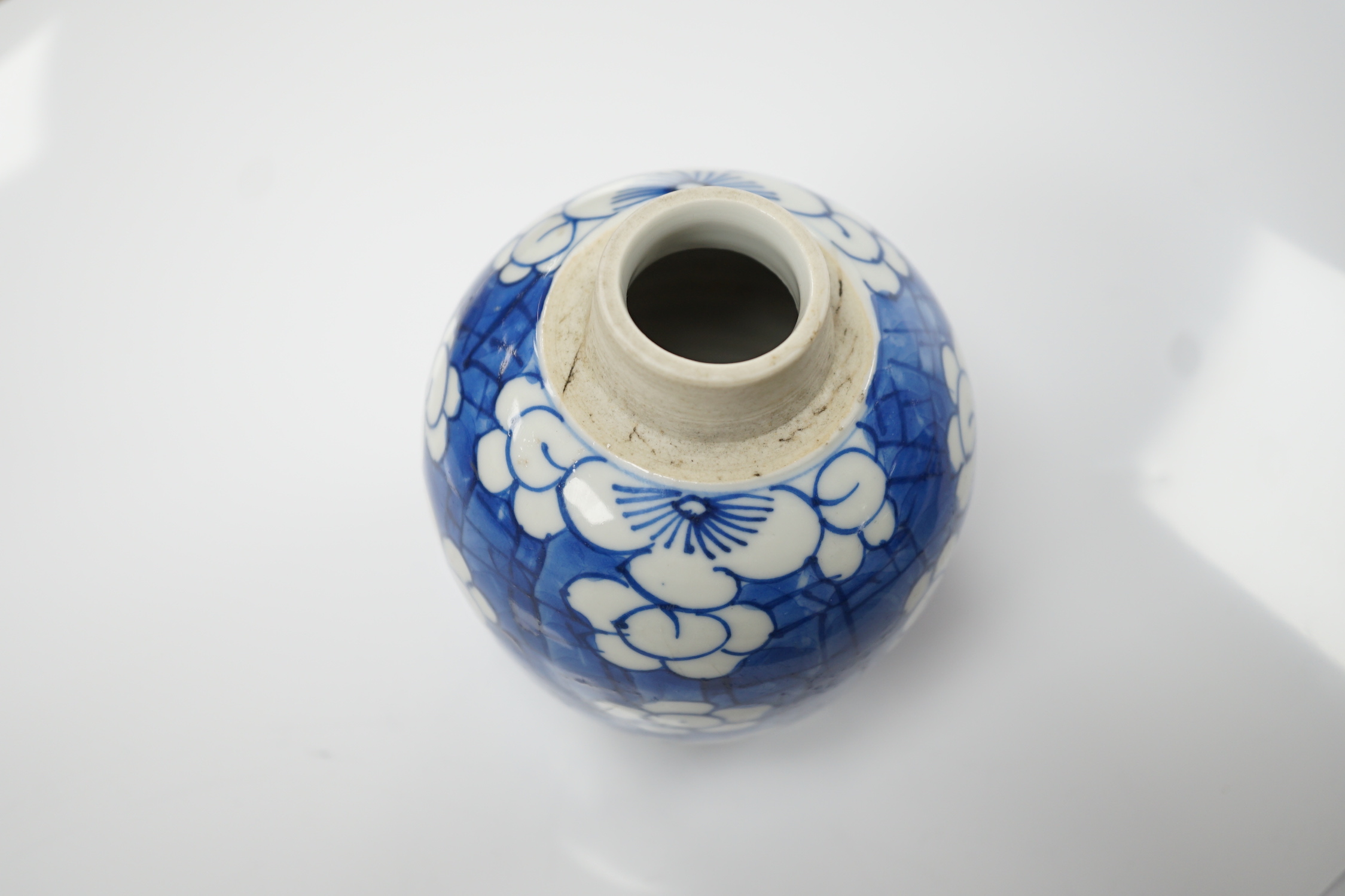 A Chinese Kangxi blue and white ‘prunus’ ovoid jar, 11cm
